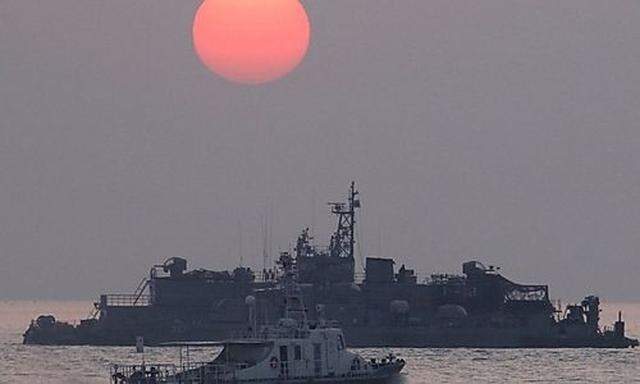 The sun rises as South Korean navy ships patrol off Yeonpyeong island