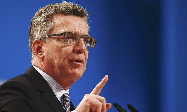 German Interior Minister de Maiziere addresses the CDU party convention in Cologne 