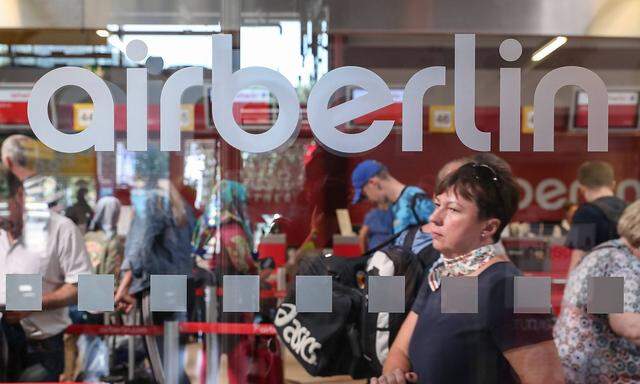 170815 BERLIN Aug 15 2017 Passengers wait to check in at a counter of Air Berlin at Tegel