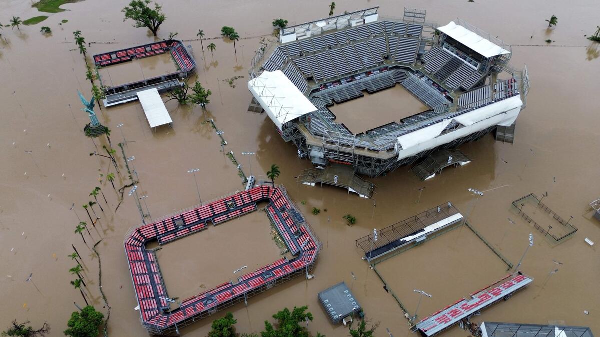 TOPSHOT - Aerial view of the flooded Arena GNP tennis court following Hurricane John in Acapulco, Guerrero State, Mexico, taken on September 27, 2024. Mexican troops scrambled Friday to help victims of a hurricane that battered the Pacific coast, including the beach resort of Acapulco, which is still recovering from a devastating storm last year. (Photo by Francisco ROBLES / AFP)
