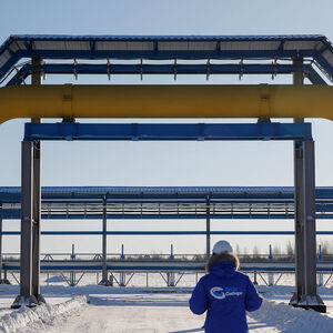 FILE PHOTO: An employee walks past a part of Gazprom's Power Of Siberia gas pipeline at the Atamanskaya compressor station outside the far eastern town of Svobodny