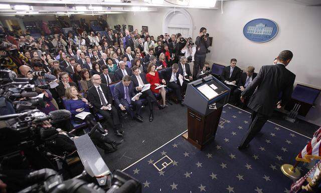 U.S. President Barack Obama leaves a news conference in the White House press briefing room in Washington