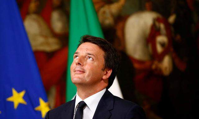 Italy Prime Minister Matteo Renzi reacts as he talks during a news conference at Chigi Palace in Rome