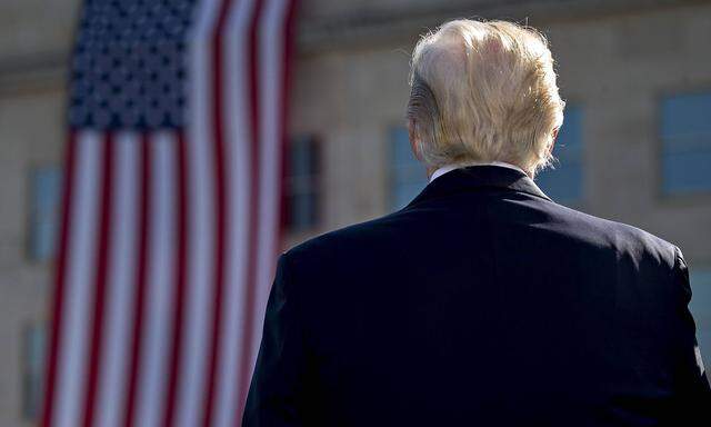 U S President Donald Trump pauses during a ceremony to commemorate the September 11 2001 terrorist