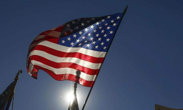 People hold U.S. flags 