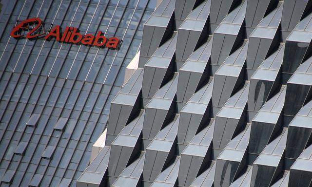 FILE PHOTO - A logo of Alibaba Group is seen on a building under construction, where the company's Beijing headquarters will be, in Beijing