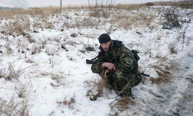 A pro-Russian separatist from the Chechen ´Death´ battalion takes part in a training exercise in the territory controlled by the self-proclaimed Donetsk People´s Republic