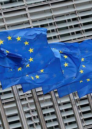 FILE PHOTO: European Union flags flutter outside the European Commission headquarters in Brussels