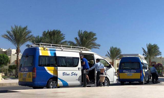 Thomas Cook operator Blue Sky Group buses line up in front of a hotel in the Red Sea resort of Hurghada