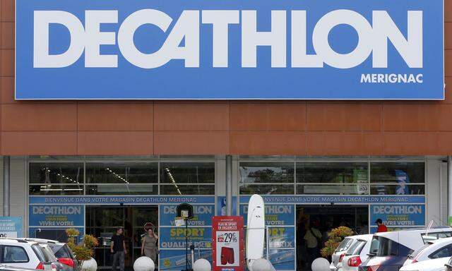 Customers leave the French sports equipment and sportswear company Decathlon store in Merignac