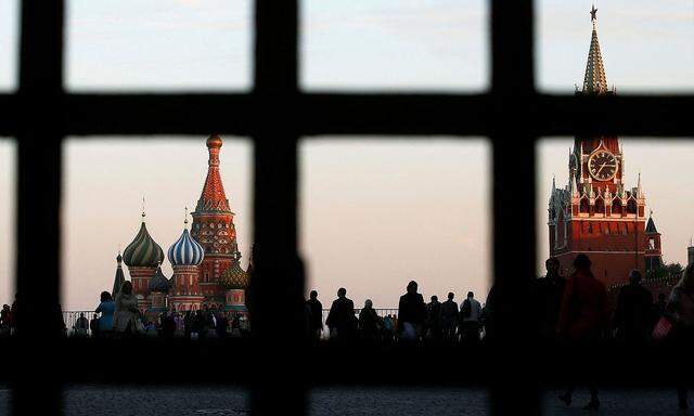 FILE PHOTO: Red Square, St. Basil's Cathedral and the Spasskaya Tower of the Kremlin are seen through a gate in central Moscow