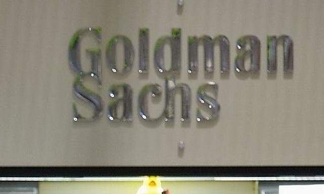 Traders work in the Goldman Sachs booth on the floor of the New York Stock Exchange