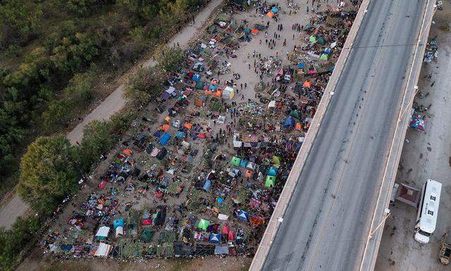 Migrants shelter near Del Rio International Bridge in Del Rio, Texas