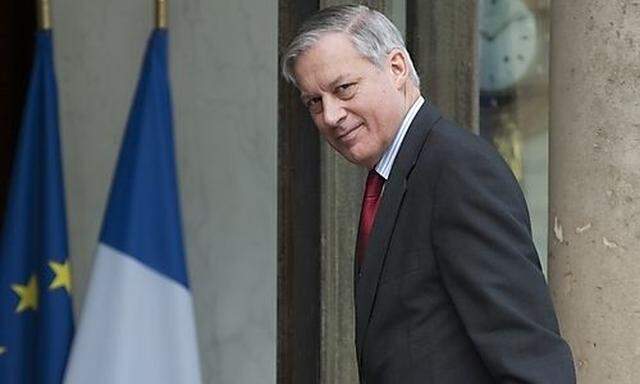 Bank of France Governor Noyer arrives to attend a meeting at the Elysee Palace  in Paris