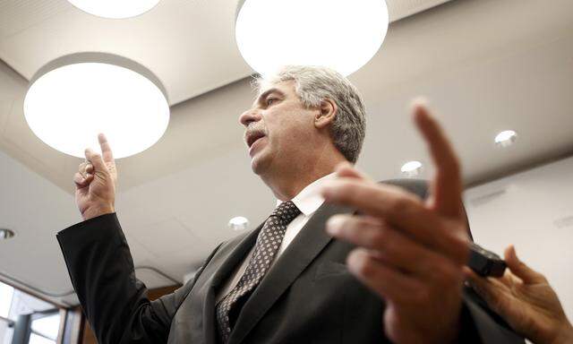 Austrian Finance Minister Schelling talks to journalists after a news conference in Vienna