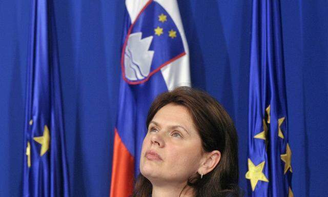 Slovenia's PM Bratusek reacts during a news conference in Ljubljana