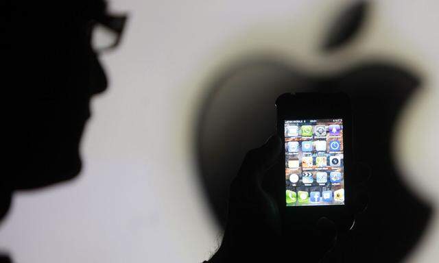 File photo illustration of a man posing with Apple iPhone 4 smartphone in Zenica