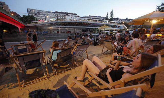 People enjoy the evening at Donaukanal in the centre of Vienna