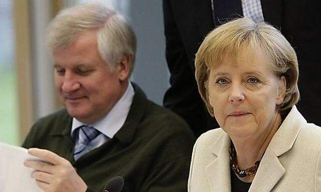 CSU head Seehofer and German Chancellor Merkel 