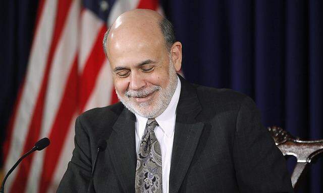 U.S. Federal Reserve Chairman Bernanke responds to reporters during his final planned news conference before his retirement, at the Federal Reserve Bank headquarters in Washington