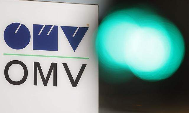 The logo of Austrian oil and gas company OMV is pictured behind traffic lights at its headquarters in Vienna