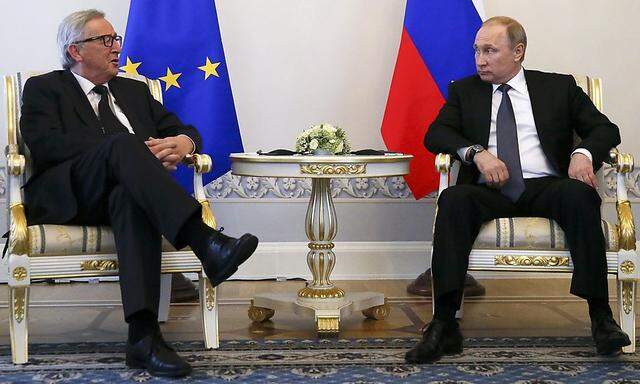 Russian President Putin meets European Commission President Juncker in St. Petersburg