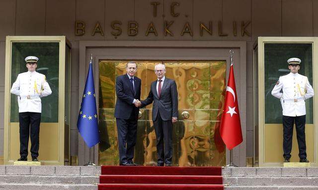 European Council President Van Rompuy shakes hands with Turkey's Prime Minister Tayyip Erdogan during a welcoming ceremony in Ankara