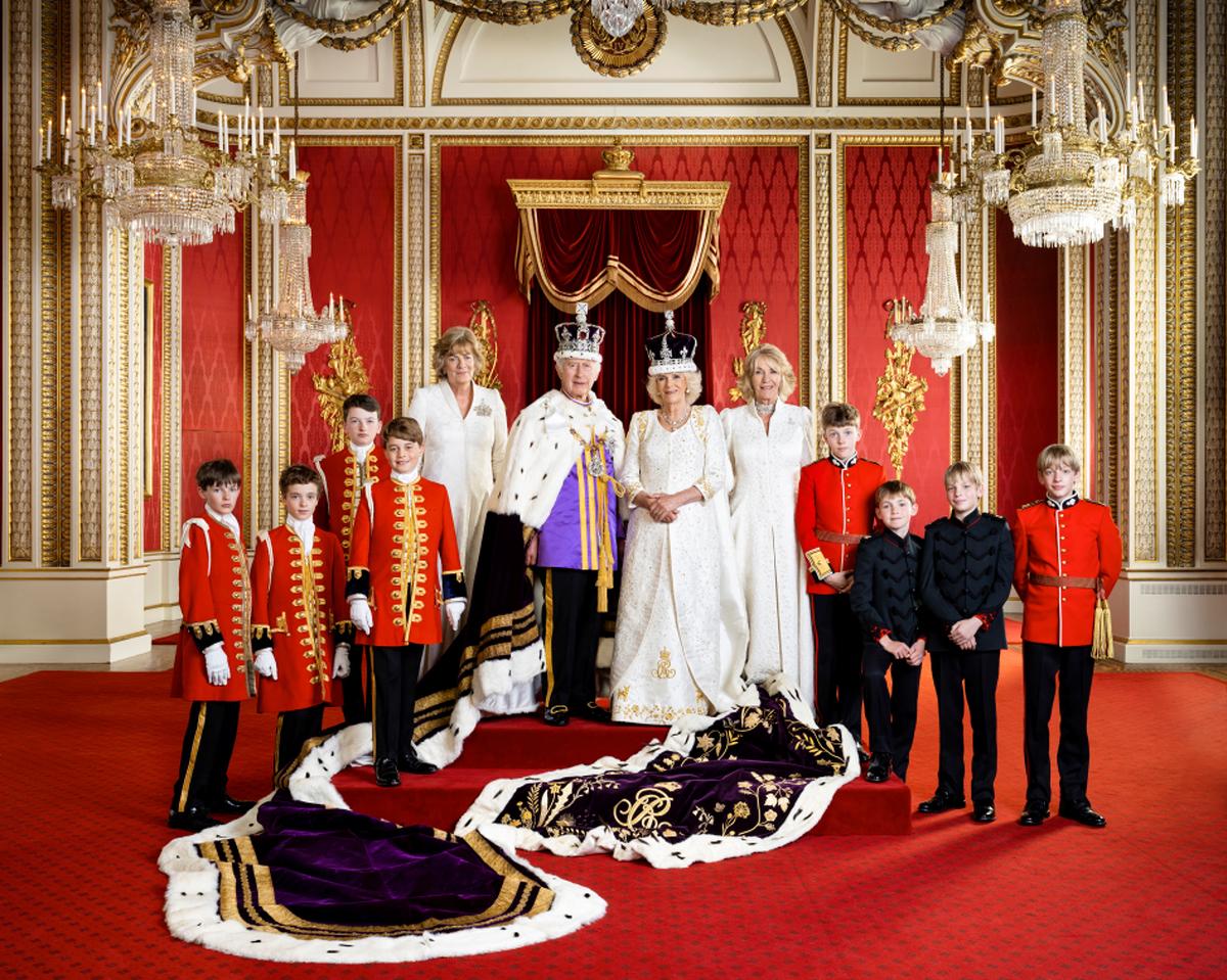 King Charles III and Queen Camilla pose with their Pages of Honour and Ladies in Attendance on the day of the coronation at Buckingham Palace