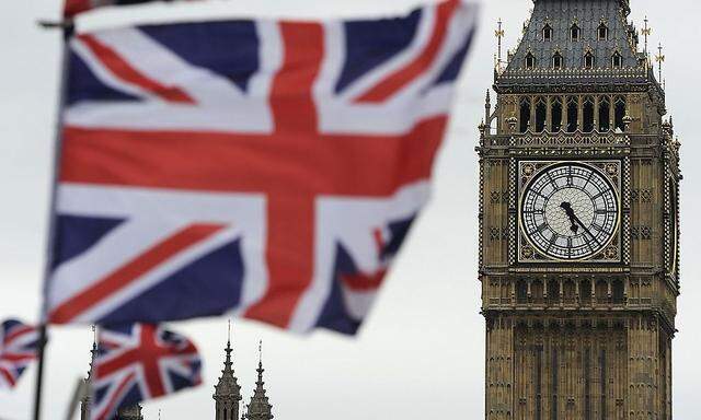 Flags are seen above a souvenir kiosk near Big Ben clock at the Houses of Parliament in central London