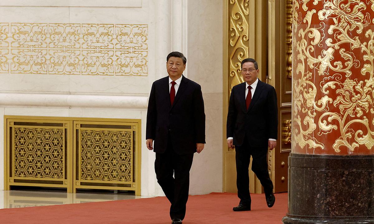 FILE PHOTO: New Politburo Standing Committee members in Beijing