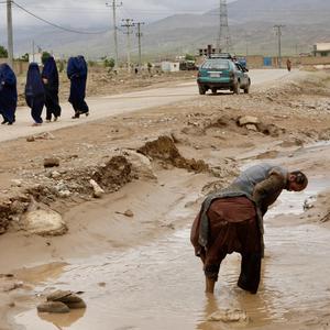 People clean up the area in the aftermath of floods following heavy rain, in Sheikh Jalal District, Baghlan province, Afghanistan May 11, 2024. REUTERS/Sayed Hassib