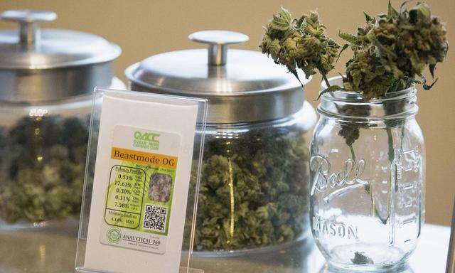 Jars of marijuana strain 'Beast Mode OG' are pictured in Johnson's Queen Anne Cannabis Club in Seattle, Washington