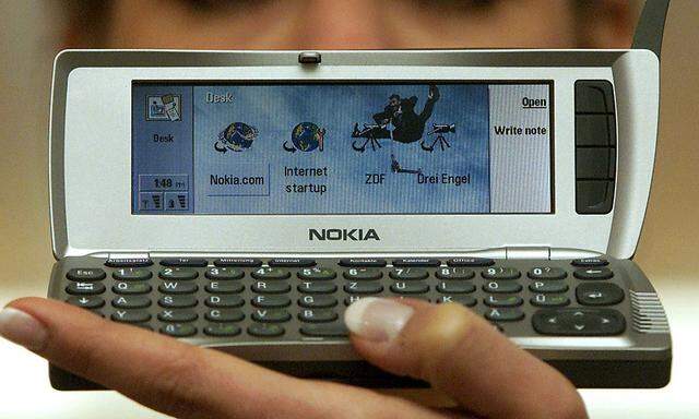 A model displays Nokia´s new mobile phone 9210 Communicator prior to its launch at the computer fair..