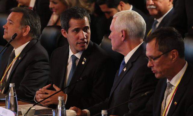 Venezuelan self procclaimed interim president Juan Guaido L and US Vice President Mike Pence take