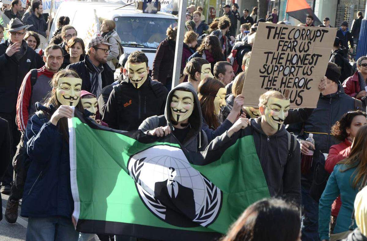 ... und die Masken der Hacker-Gruppierung "Anonymous"....