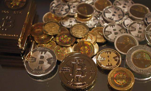 Some of Bitcoin enthusiast Mike Caldwell's coins are pictured at his office in Sandy, Utah