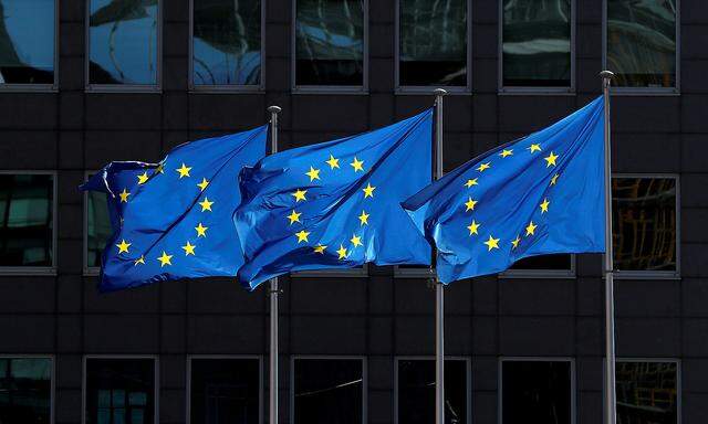 FILE PHOTO: European Union flags flutter outside the European Commission headquarters in Brussels, Belgium