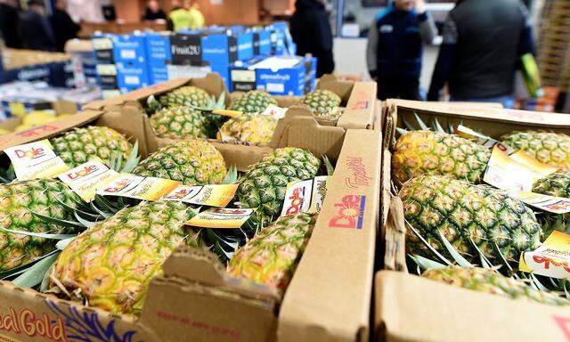 Pineapples are offered at the wholesale fruits and vegetables market in Hamburg