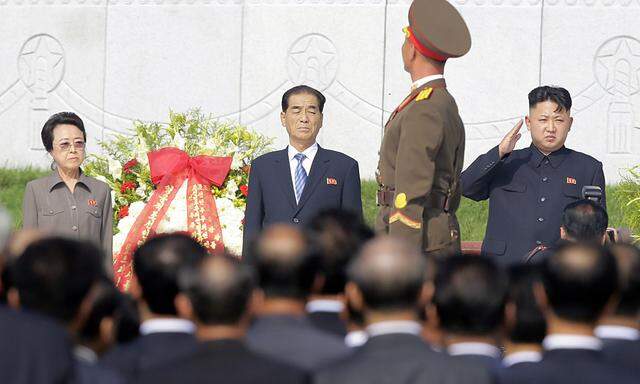 File photo of North Korean leader Kim saluting, while his aunt Kim Kyong Hui watches during a ceremony in Pyongyang