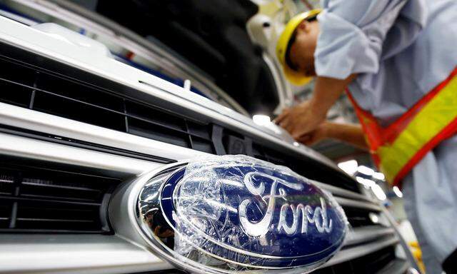 FILE PHOTO: A man works at Ford Vietnam car factory in Hai Duong