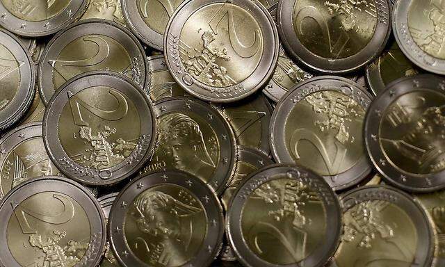 Two Euro coins are seen in the Austrian Mint headquarters in Vienna
