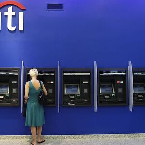 A woman uses an ATM inside a Citi bank branch in New York