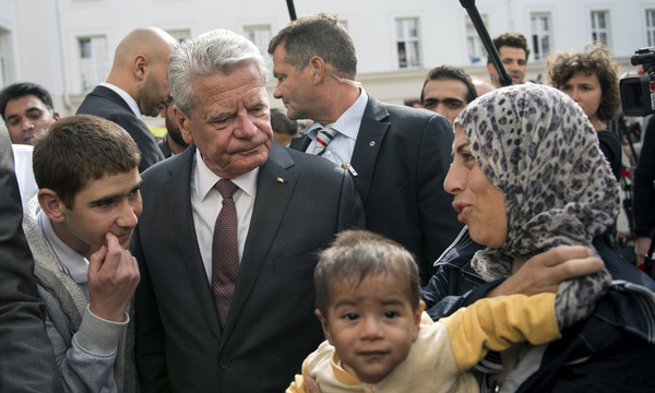 German President Gauck visits an asylum seekers accommodation facility in Berlin