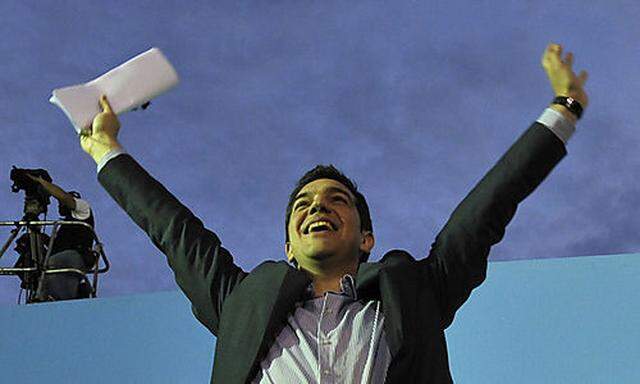 Greek leader of Coalition of the Radical Left party (SYRIZA) Alexis Tsipras waves to the crowd after 