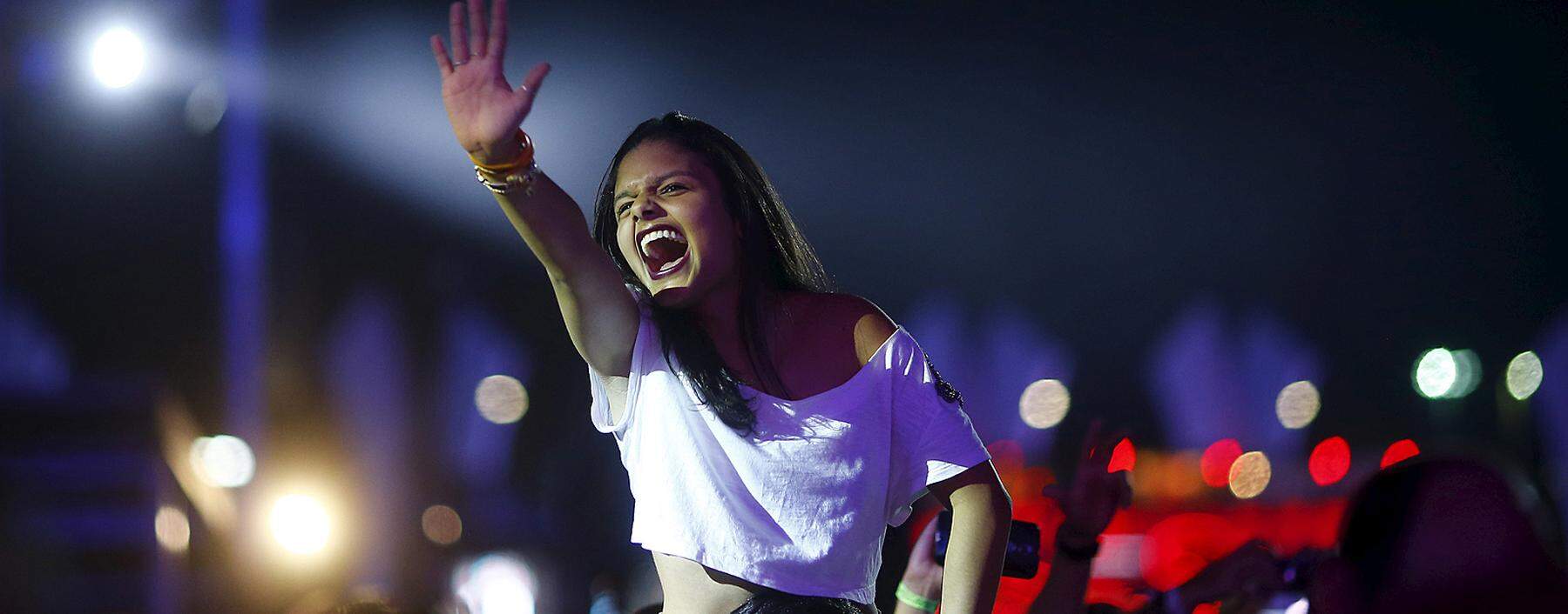 Rock fans cheer during a concert at the Rock in Rio Music Festival in Rio de Janeiro