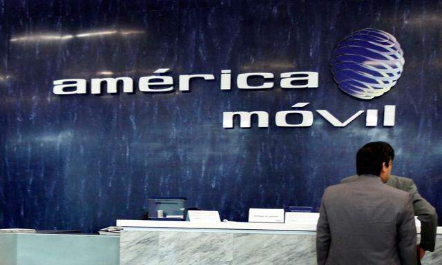 The logo of America Movil is seen on the wall of the reception area in the company's corporate offices in Mexico City in this file photo