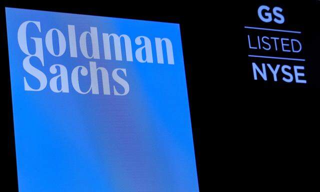 FILE PHOTO: The ticker symbol and logo for Goldman Sachs is displayed on a screen on the floor at the NYSE in New York