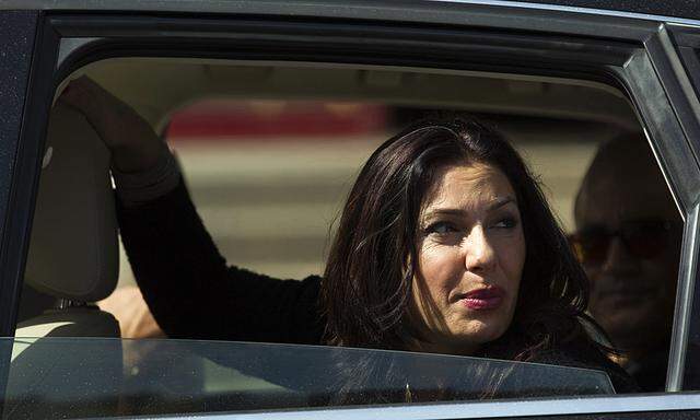 Likud legislator Regev looks out a car window in Netanya