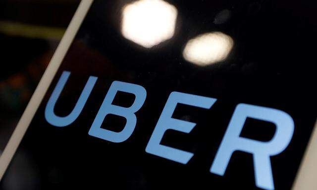 The logo of Uber is seen on an iPad, during a news conference to announce Uber resumes ride-hailing service, in Taipei