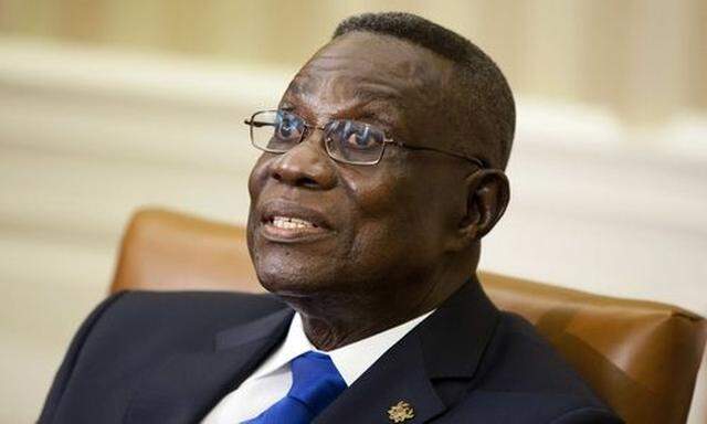 File photo shows Ghana's President John Evans Atta Mills speaking during a meeting with U.S. President Barack Obama in the Oval Office